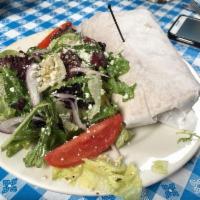 Gyro Sandwich · Shaved beef and lamb cooked on a spit, topped with tzatziki, fresh tomatoes, red onion, and ...