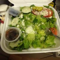 Greek Salad · Lettuce, tomatoes, cucumbers, pepperoncini's, black olives, and feta cheese. Served with you...