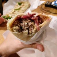 Norwegian Meatball Wrap · Norwegian meatballs and surkal topped with gjetost cheese sauce wrapped in our house-made le...