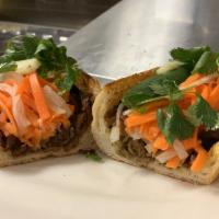 Grilled Pork Sandwich · Our most popular banh mi. Thinly sliced lemongrass marinated pork grilled to perfection on a...