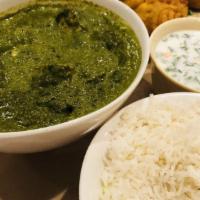 Palak Paneer · Simmered spinach with exotic spices added with cottage cheese.
