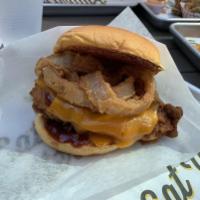 Cheesy BBQ Sandwich · Hand-breaded filet with melted Cheddar, onion rings, and a sweet BBQ sauce. Prepared from sc...