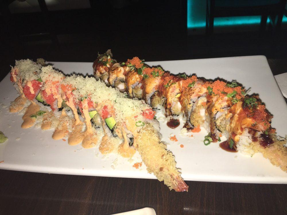 Hurricane Roll · Shrimp tempura, eel, kani and avocado inside and topped with seared spicy salmon with chef's special sauce.