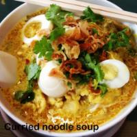 Curried Noodle Soup · Served with steamed bean sprouts. and boiled egg with rice noodles