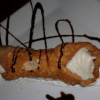 Cannoli · Fried pastry dough filled with a sweet creamy filling.