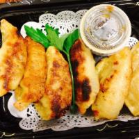 Gyoza · Pan-fried Japanese dumpling.