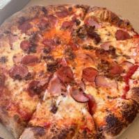 Meat Lover Pizza · Pepperoni, shaved ham and sausage.