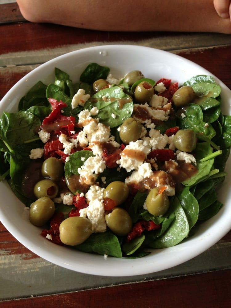 Greek Salad · Spinach, feta, Kalamata olives, sun dried tomato and balsamic dressing.
