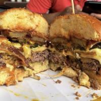 Hangover Burger · Battered thinly sliced potato, crisp bacon, Swiss and cheddar, fried egg and pickles with ke...
