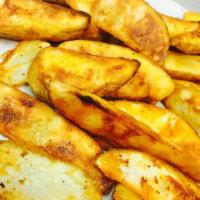 Potato Wedges · Oven baked and seasoned.