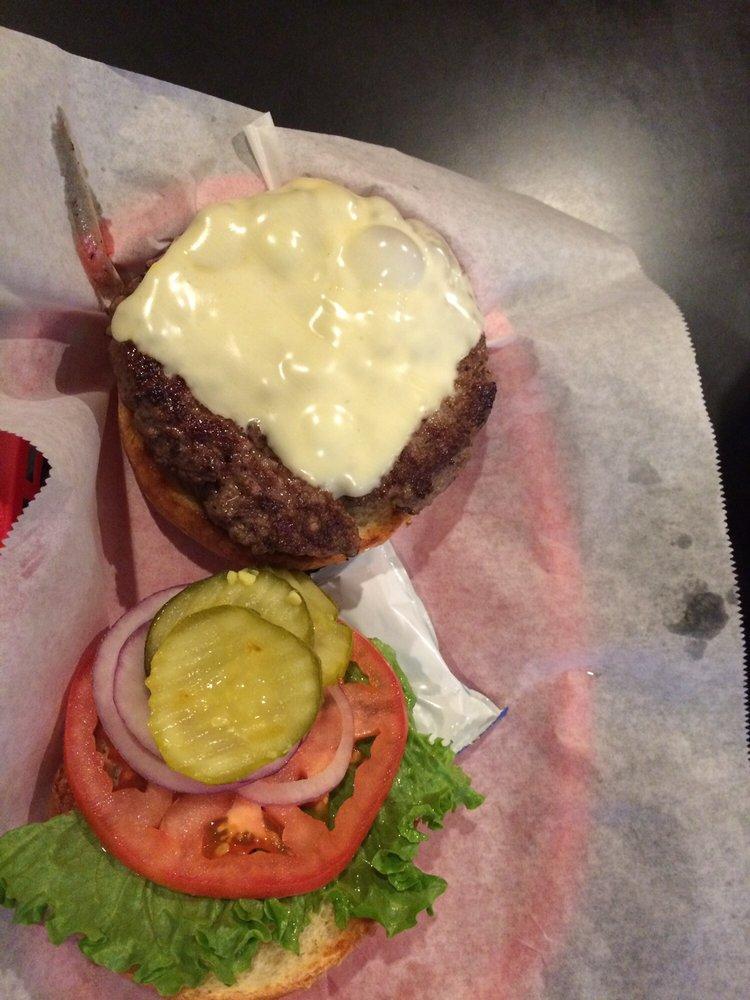 Black Angus Burger · Black angus beef thats grilled to perfection. Served on a gourmet roll. Served on a toasted bun with lettuce, tomato, pickle and purple onion.