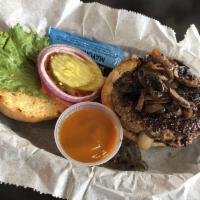 Lee Burger · Angus patty with white cheddar melted inside the burger.