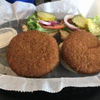 Crabby Sliders · 2 seasoned crab cakes deep fried golden brown and served on toasted slider buns.