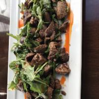 39 Spice Beef Plate · Marinated beef bites sauteed with arugula and criminology mushrooms.