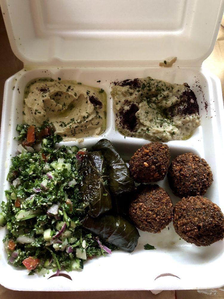 Mixed Taste · Baba ghanouj, hummus, tabouli, 4 piece grape leaves and 4 piece falafel. Served with pita.