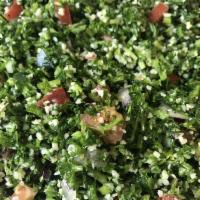 Tabouli Salad · Cracked wheat, chopped parsley, onion, tomatoes, cucumber with olive oil and lemon juice.