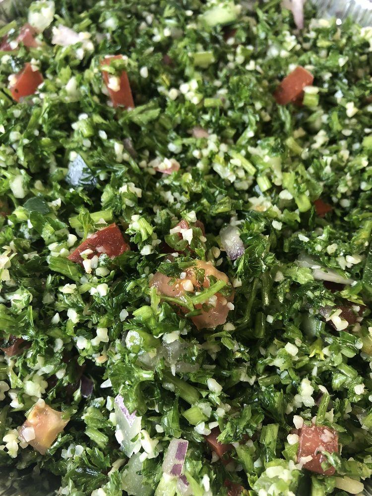 Tabouli Salad · Cracked wheat, chopped parsley, onion, tomatoes, cucumber with olive oil and lemon juice.