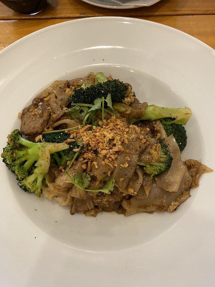 Pad See Ew · Flat rice noodles with egg and broccoli.