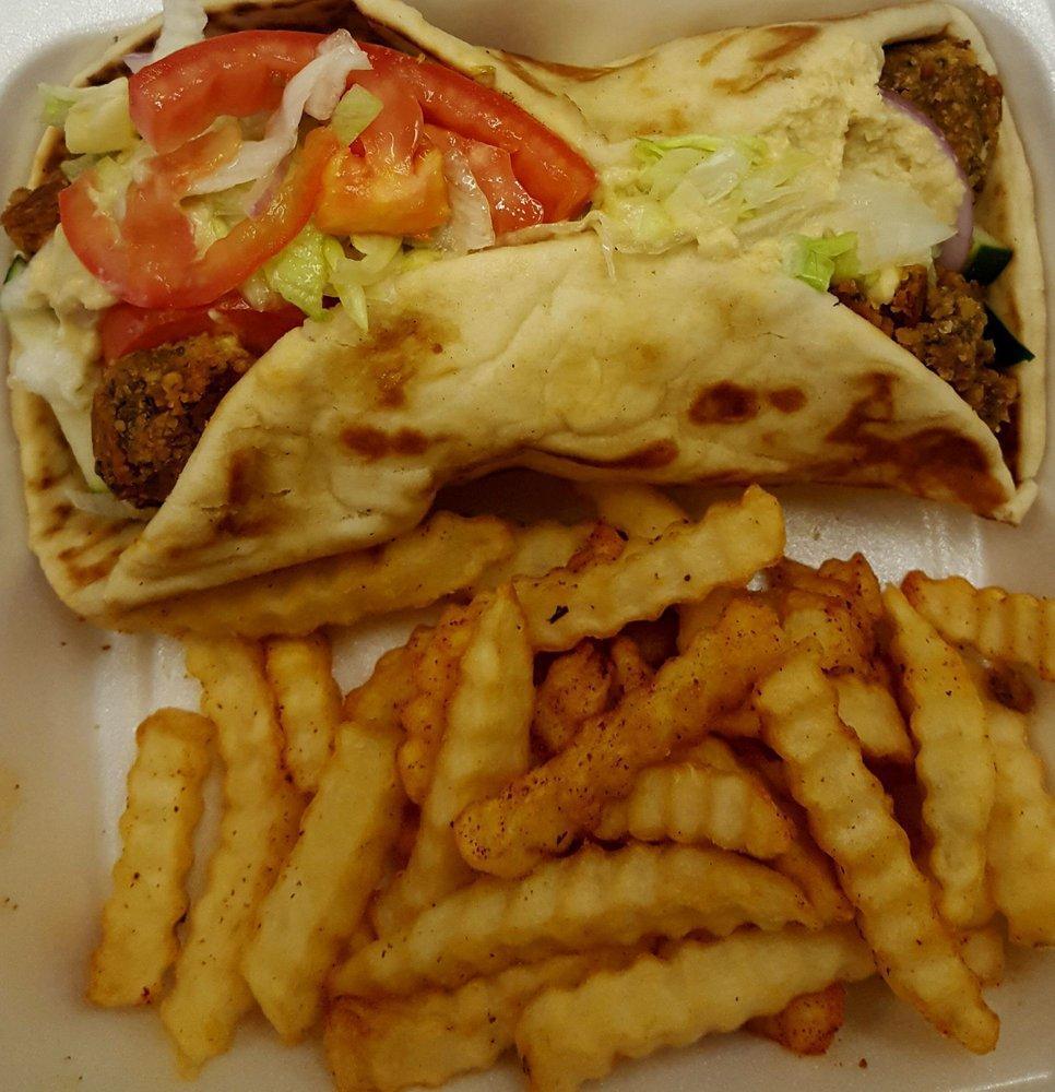 Falafel Gyro · Lettuce, tomato, onion, seasoned gyro meat, homemade white sauce, on a fresh pita. Served with fries.