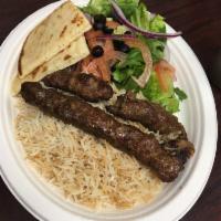 Shami Kabob · 2 skewers of lean ground beef mixed 24 hours prior with special homemade spices. Served with...