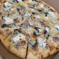 White Pizza · Ricotta cheese, mozzarella cheese, garlic, basil, and olive oil.