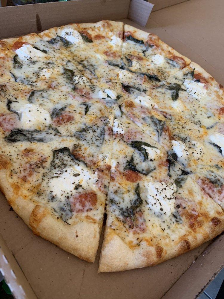 White Pizza · Ricotta cheese, mozzarella cheese, garlic, basil, and olive oil.