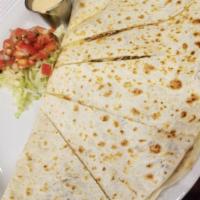 Quesadilla · Blend of 3 Mexican cheeses and grilled corn on a flour tortilla.