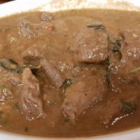 Lamb Curry · Boneless lamb cubes cooked in traditional South Indian curry.