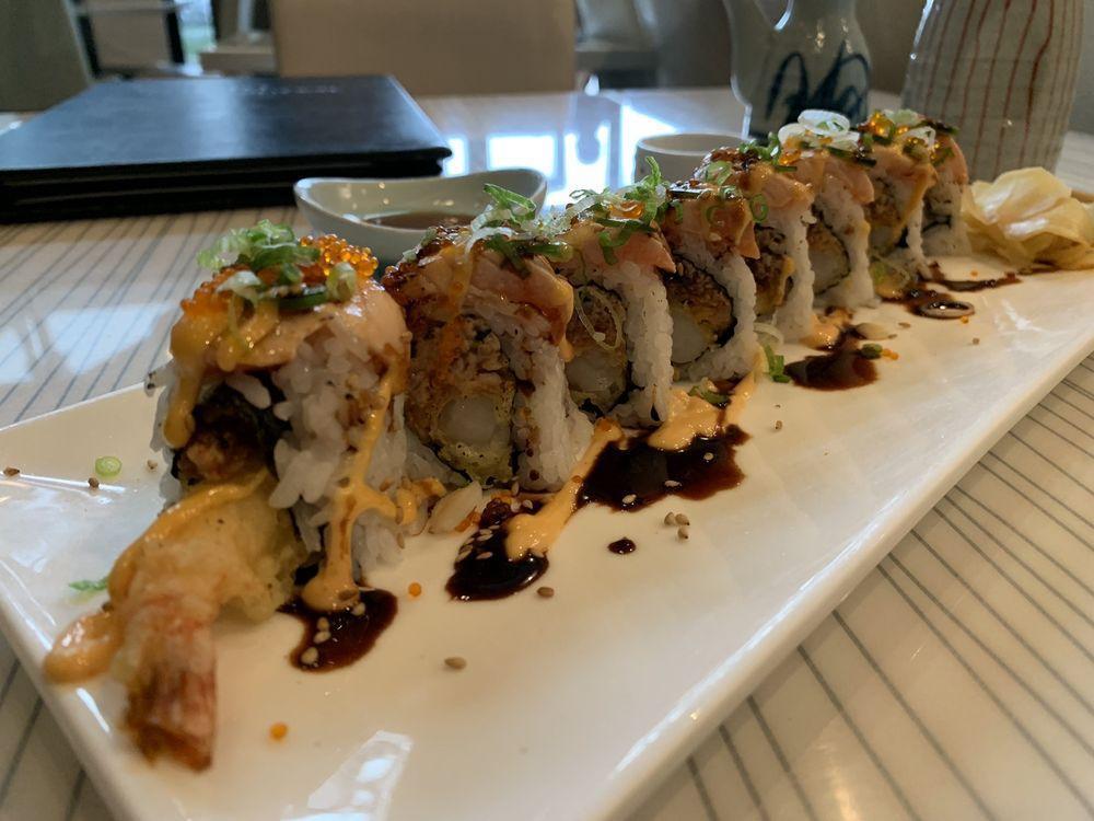 Tokyo Sushi Roll · Spicy tuna, shrimp tempura, topped with salmon, jalapeno and spicy mayo in baked. Served raw.