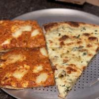 Vodka Sicilian Pizza · Twice baked crust with smooth tomato vodka cream sauce and a mix of Italian cheeses.
