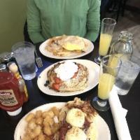 The Cherry Creeker · Our slow-cooked award-winning corned beef hash topped with 2 poached eggs and hollandaise sa...