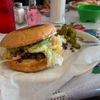 Torta · Telera bread served with your choice of meat, lettuce, tomato, avocado slices, sour cream an...