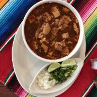 Menudo · Served with diced onions, cilantro, lime and 2 tortillas.