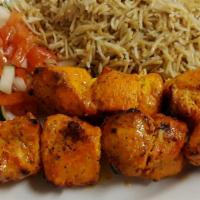Chicken Kabob · Marinated chicken breast charbroiled, served with rice, salad, and bread.