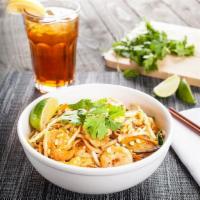 Pad Thai · The national dish of Thailand. Rice noodles with Thai peanut sauce, egg, carrots, and scalli...