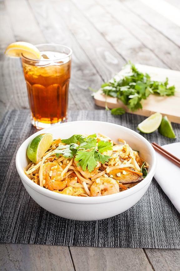 Pad Thai · The national dish of Thailand. Rice noodles with Thai peanut sauce, egg, carrots, and scallions. Topped with chopped peanuts.