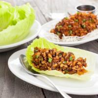Chicken Lettuce Wraps · Minced chicken, mushrooms, scallions, and garlic and Asian slaw. Served with romaine lettuce...