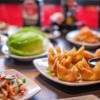 Crab Rangoons · Handmade rangoons with 100% blue crab claw meat, cream cheese, scallions, cabbage, and onion...