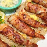 Shrimp Brochette · Butterfiled shrimp wrapped in bacon stuffed with Monterey Jack cheese and jalapenos served w...