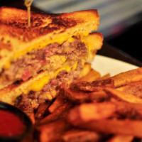 Merica Meltdown Burger · House blend, caramelized onions, bank sauce and grilled cheese challah.