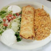 Chimichanga · Stuffed with chicken or shredded beef, quick-fried, with guacamole, pico de gallo, and sour ...