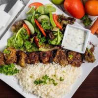 Chicken Kabob · Chicken breast cubes marinated with special spices and grilled. Served with rice, salad and ...