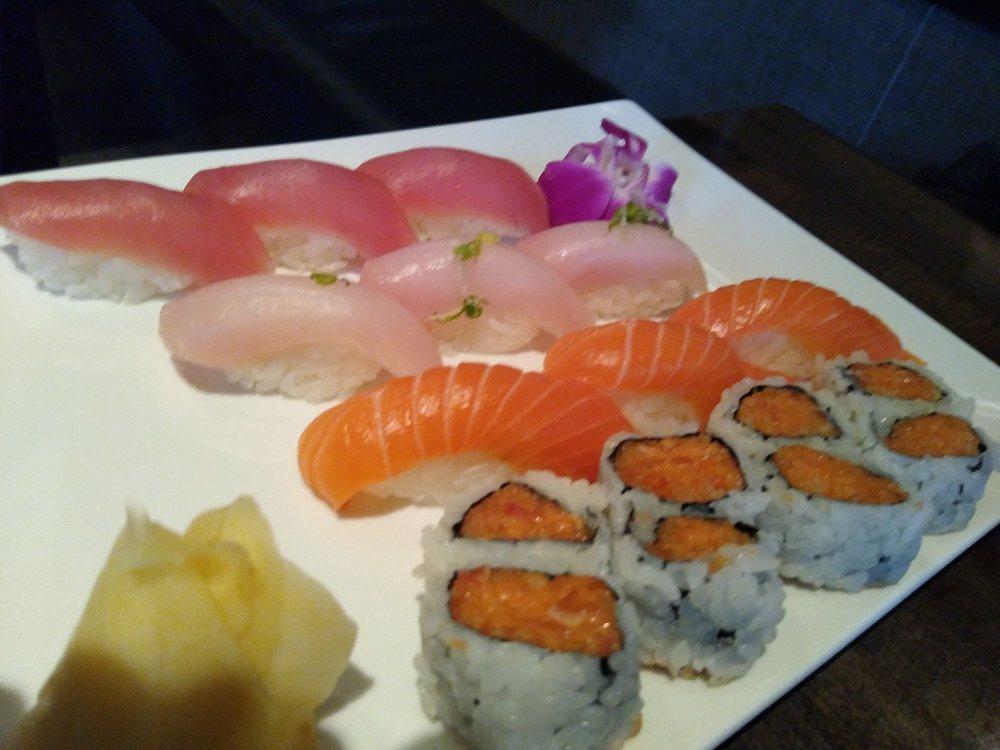 Triple Sushi · 3 pieces of tuna, yellowtail and salmon and a spicy salmon roll. Served with miso soup or salad.