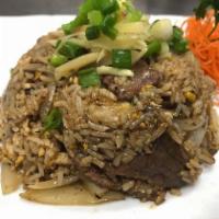 Bangkok Beef Fried Rice · Fried rice with beef marinated for 3 days and stir-fried with white onions, green onions, an...