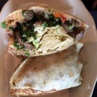 Carne Asada Burrito · Grilled steak, refried beans, rice, Jack cheese, avocado slices, cilantro and diced onion.