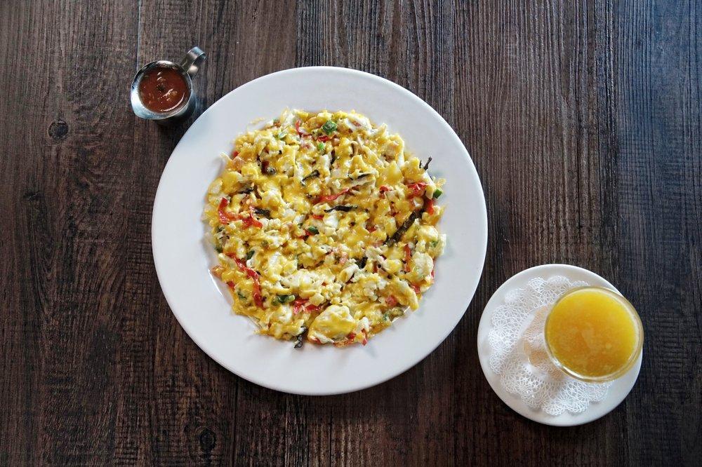 Migas · Scrambled eggs, onion, fresh jalapeno, tomato, tortilla strips, aged cheddar and homemade salsa. Spicy. Served with Flour Tortillas and your choice of side.