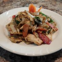 Drunken Noodle · Stir-fried flat-wide rice noodles with basil, tomato, onion, bell pepper and carrot.