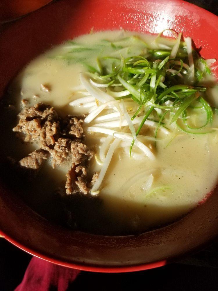 Oxtail Ramen · Oxtail bone marrow based soup; topped with marinated halal beef, onion, scallions and bean sprouts.