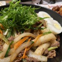 Bulgogi · Sliced marinated beef ribeye, onions, scallions and mushrooms. Served with 4 pieces of fried...