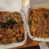 Drunken Noodles · Pad kee-mao.  Your choice of meat stir-fried with wide flat noodles, egg, onions, basil, bam...